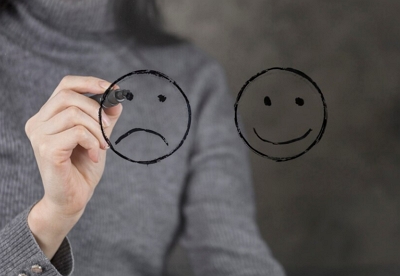 emotional contagion header image of happy and sad faces