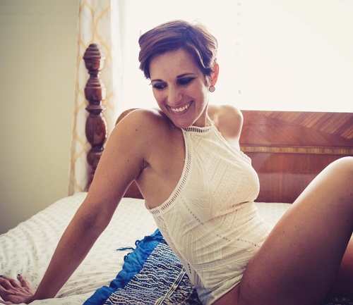 mature woman smiling on bed